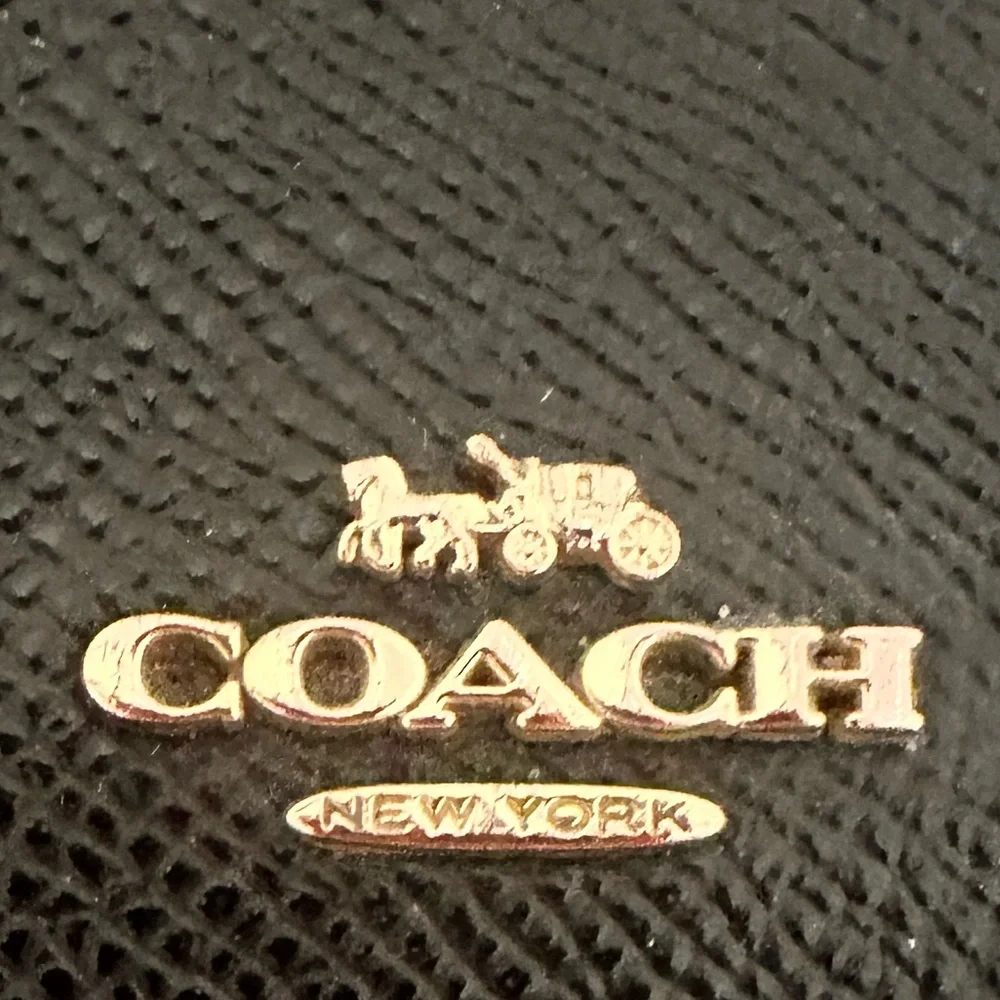 Coach accordion zip